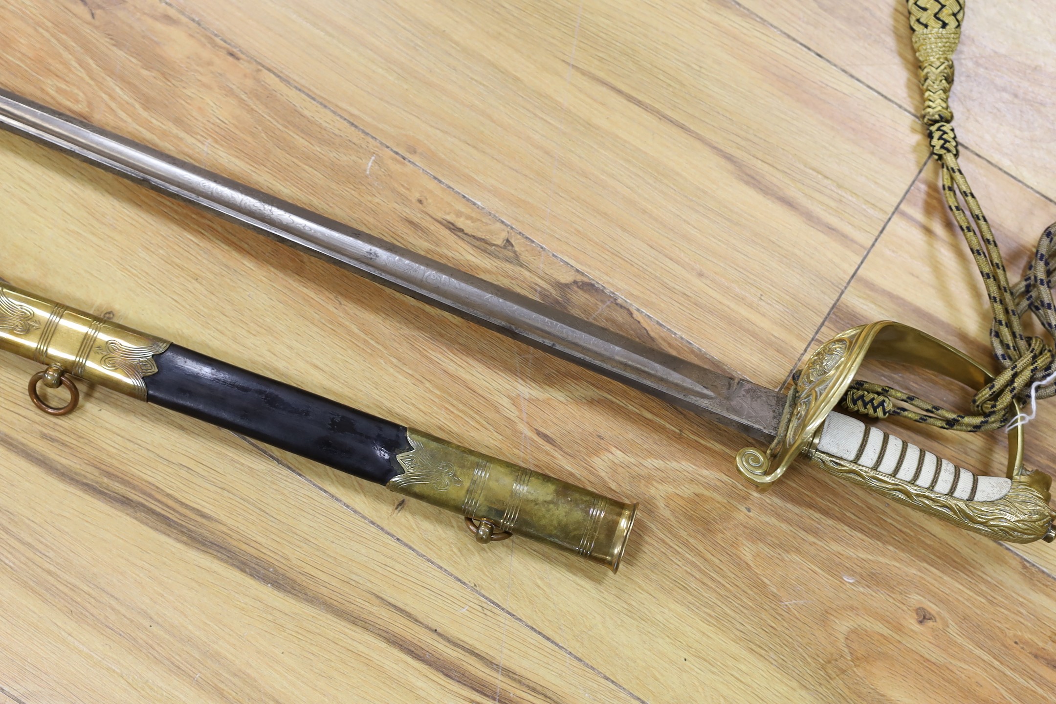 A George V naval officers sword, made by Friedeberg Portsea, serial number 4351 stamped to spine